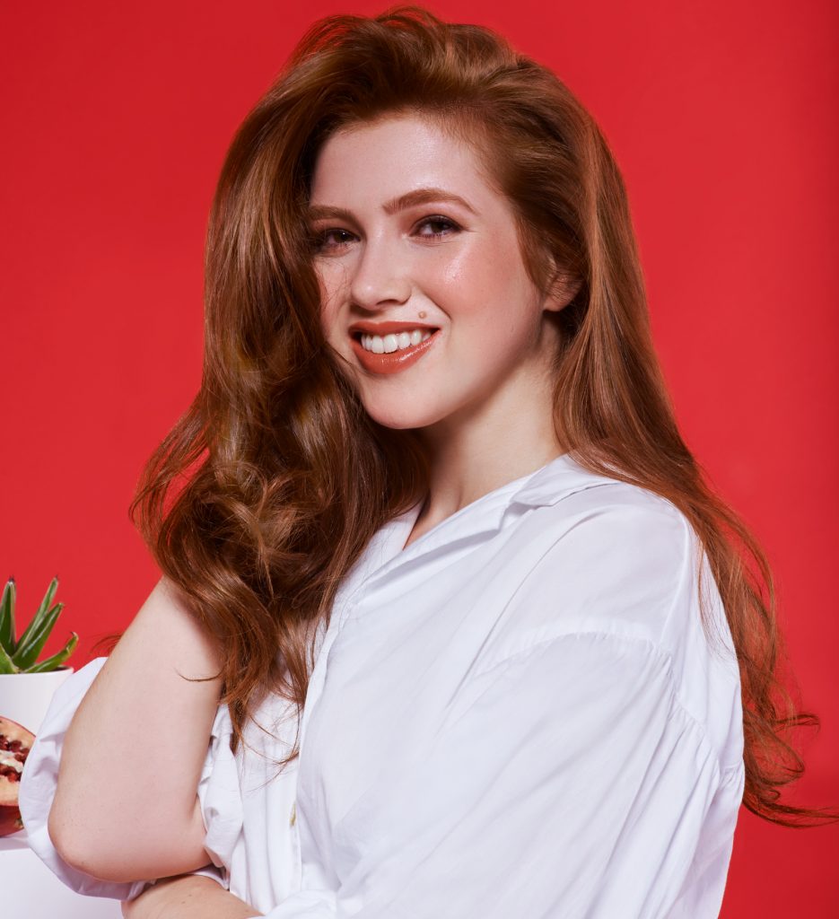 Female model with long copper hair