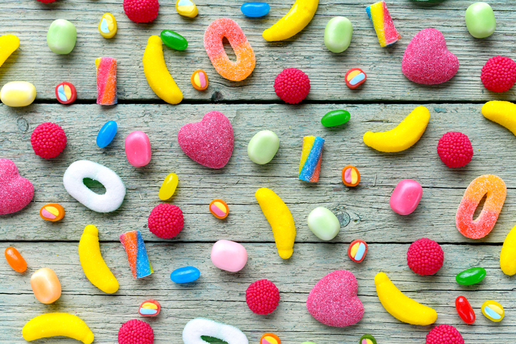 sweets and candies on a wooden background