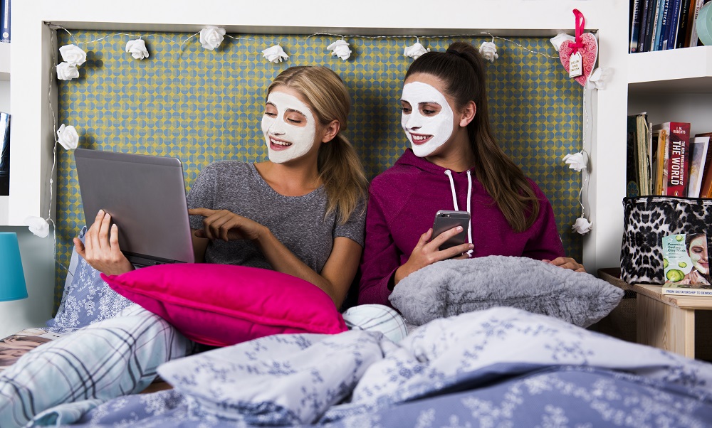 Fresher's Week sat on bed