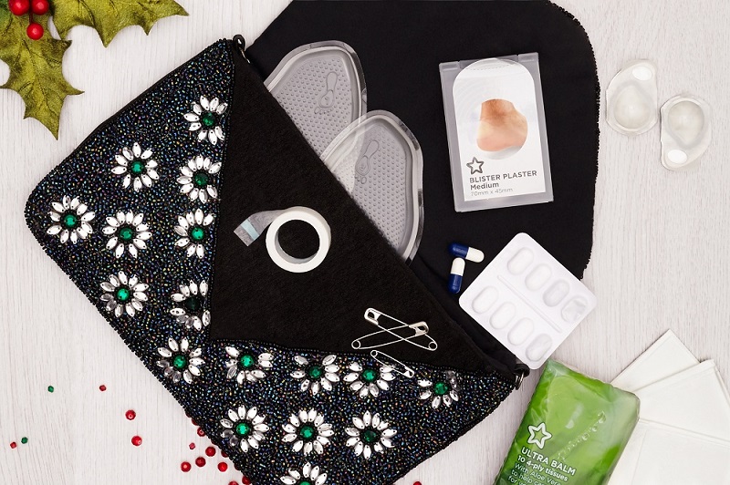christmas-party-bag-essentials-contact-lenses-tit-tape-party_feet-tissues-blister-plasters-safety-pins-paracetamol-Still_life