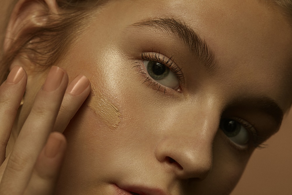 Female model with BB swatch on her cheek