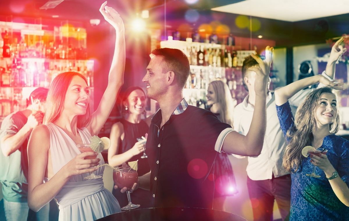 Students partying on a night out with cocktails