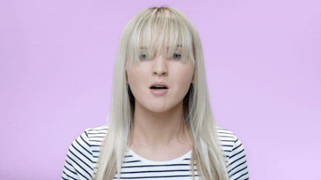 woman blowing her own hair