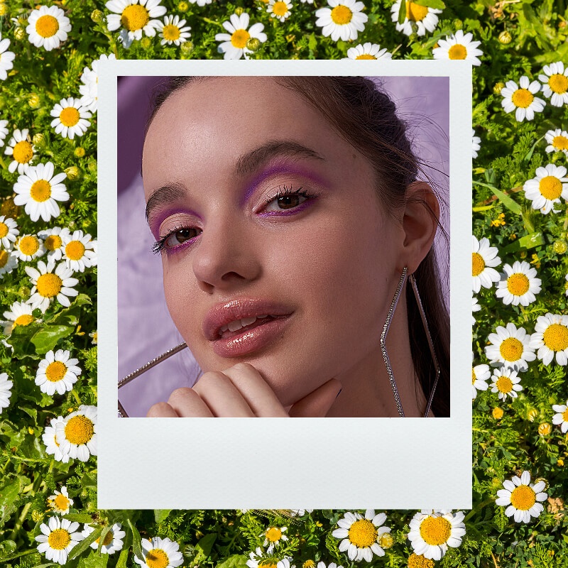 Festival beauty in the present day with cut crease eye look and daisies 