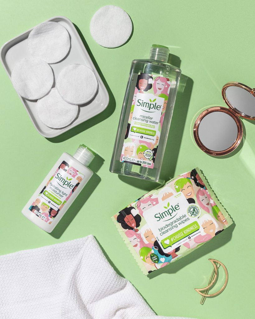 Green background with 3 products being discussed displayed on top alongside other skincare items 