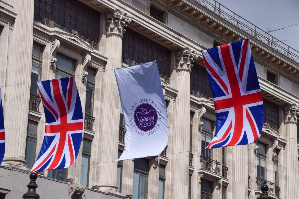 Queen's platinum Jubilee sign and flags oxford Street