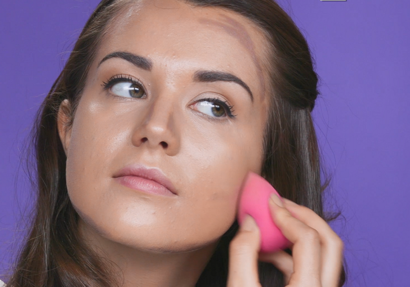 Woman blending contour